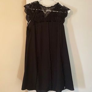 Black dress with crochet detail.